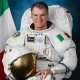 Astronaut Paolo Nespoli posing with a spacesuit