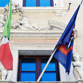 Flags on the balcony of Palazzo Sardagna