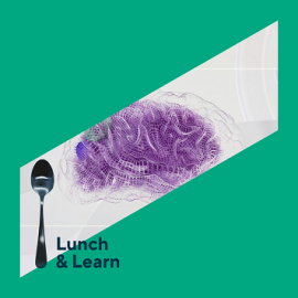 a spoon next to a lilac sponge shaped like a brain