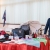 Prodotti esibiti sul tavolo e a destra il responsabile della ditta Essebie